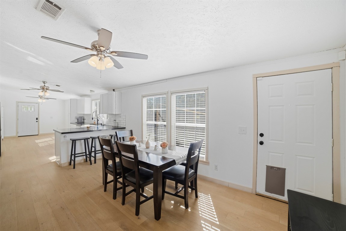 4048 Sutherland Springs Road Seguin, TX 78155 - Photo 5 of 23 a view of a dining room with furniture and a chandelier