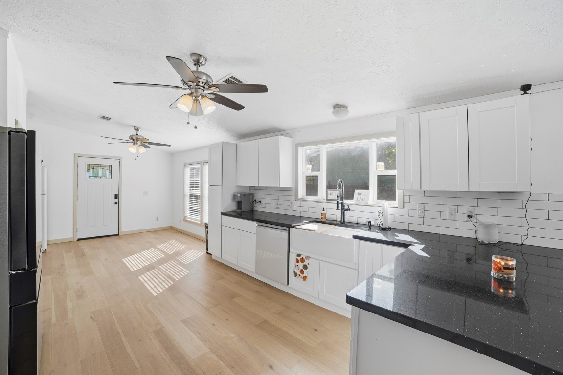 4048 Sutherland Springs Road Seguin, TX 78155 - Photo 10 of 23 a kitchen with a sink cabinets and window