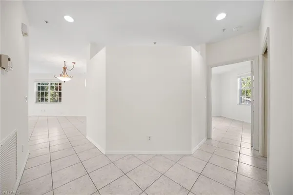 a view of an empty room and closet area