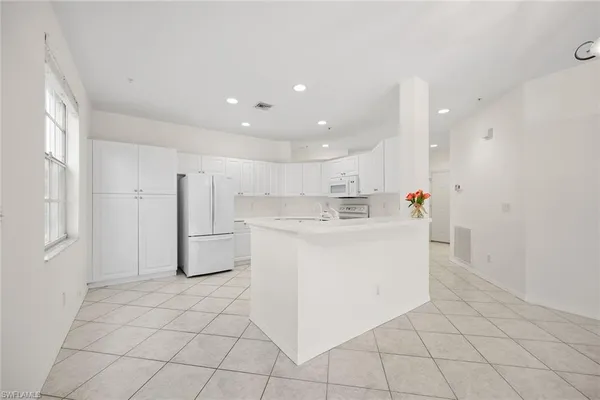 a view of kitchen with furniture and wooden floor