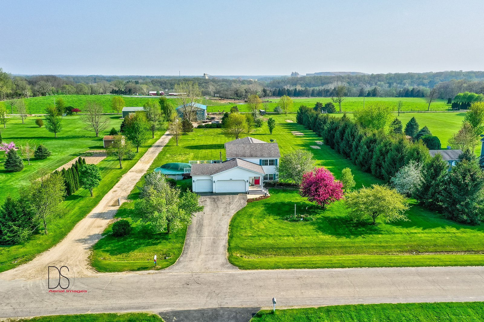 2064 North 3569th Road Serena, IL 60549 - Photo 3 of 36 a view of a garden with a swimming pool