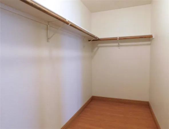 a view of a backyard with wooden fence