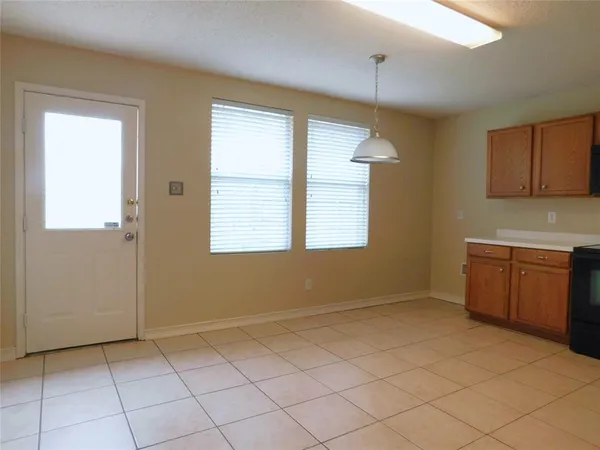 a view of a kitchen with a dishwasher and a window