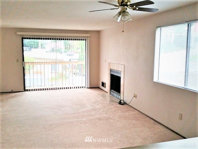 23523 Edmonds Way Edmonds, WA 98026 - Photo 2 of 7 an empty room with fan and windows
