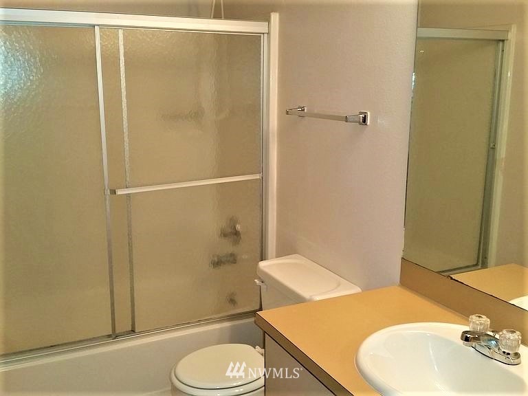 23523 Edmonds Way Edmonds, WA 98026 - Photo 5 of 7 a bathroom with a sink toilet and shower