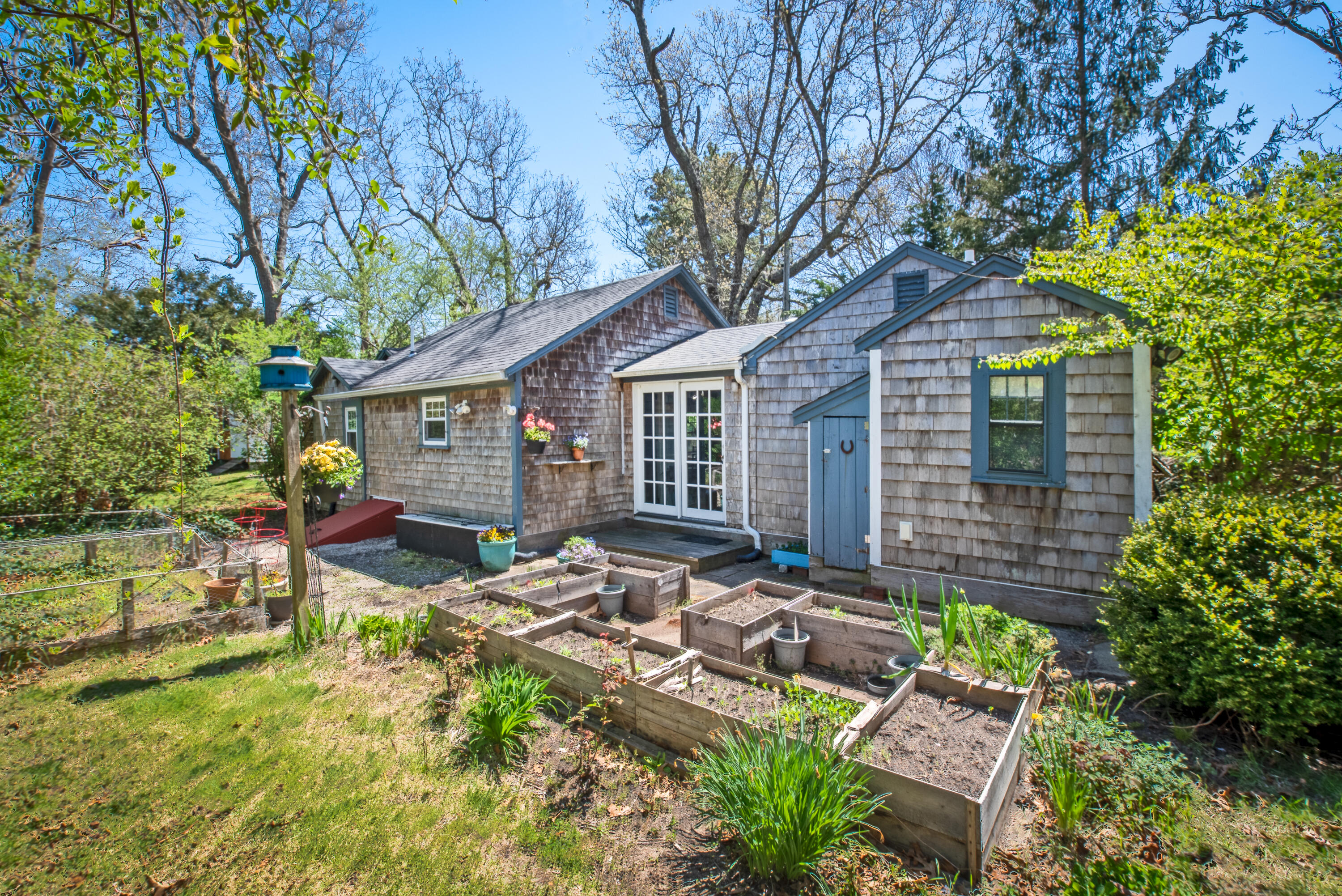 a front view of a house with garden