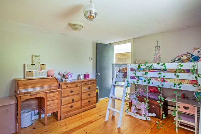 a room with toys and wooden floor
