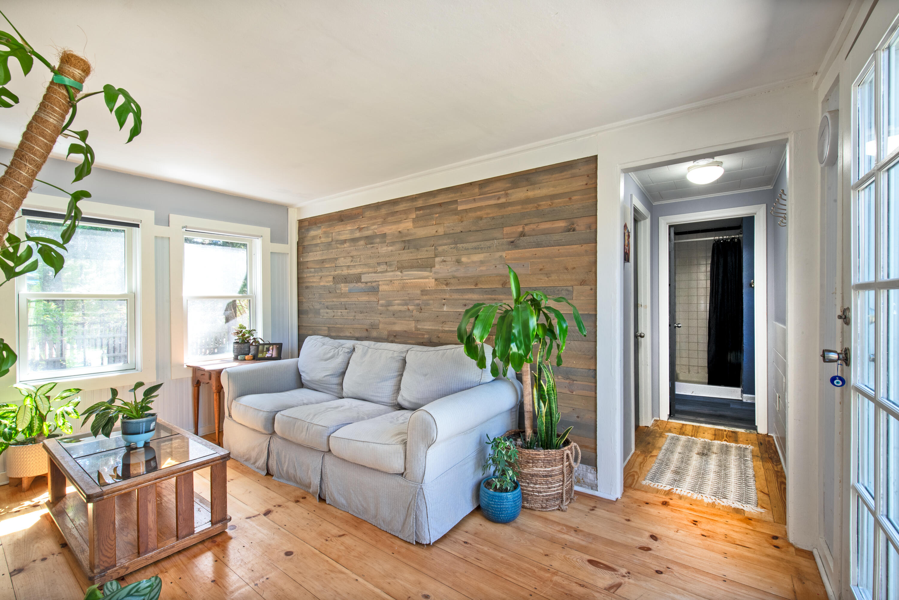 35 Old County Road, Unit 1 Eastham, MA 02642 - Photo 3 of 30 a living room with furniture potted plant and a window