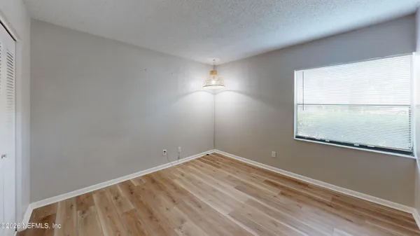 a view of a big yard with lots of green space