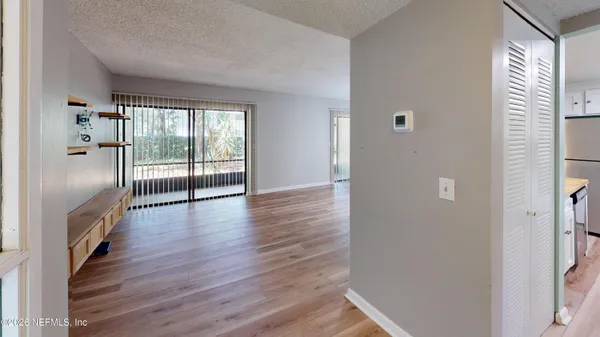 a view of a garden with a table and chairs