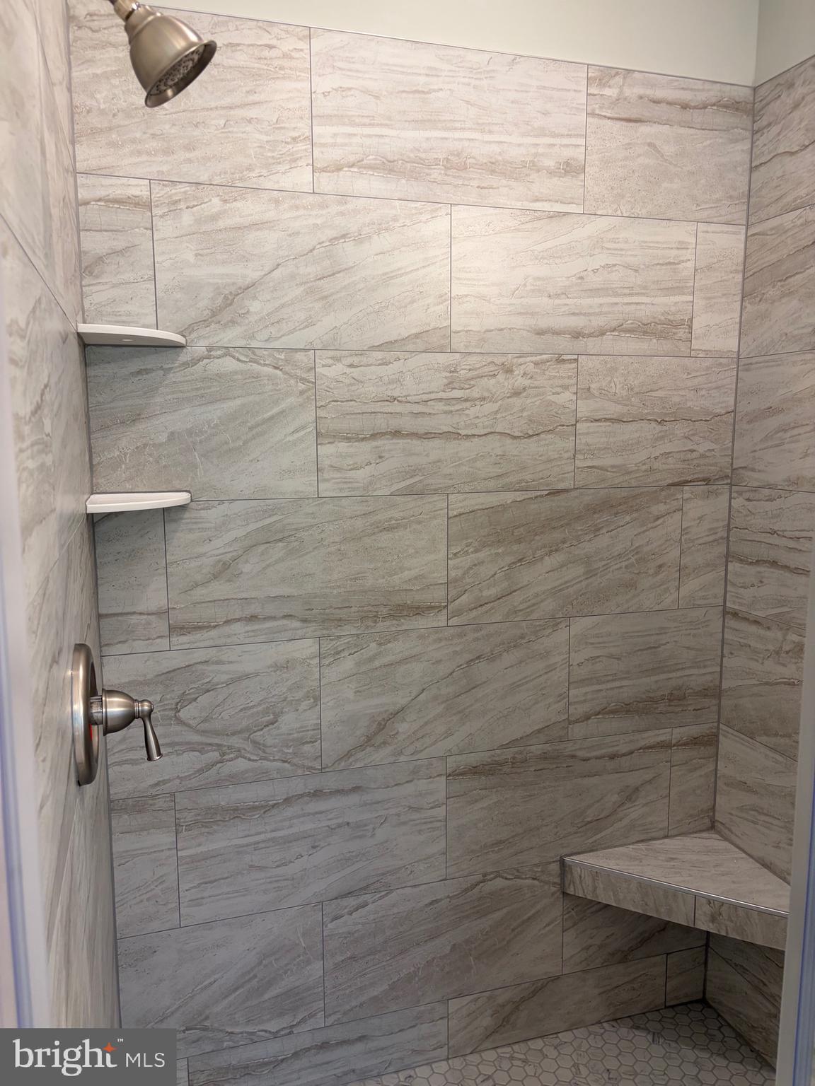 57 Waterman's Way Reedville, VA 22539 - Photo 10 of 43 Primary walk-in shower with bench