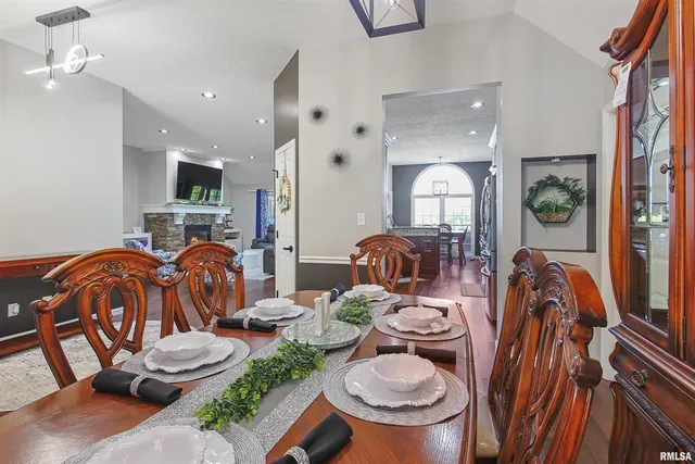 a room with furniture a rug and white walls