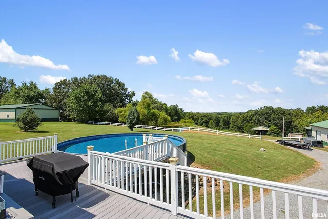 a view of a two chairs and table in the terrace