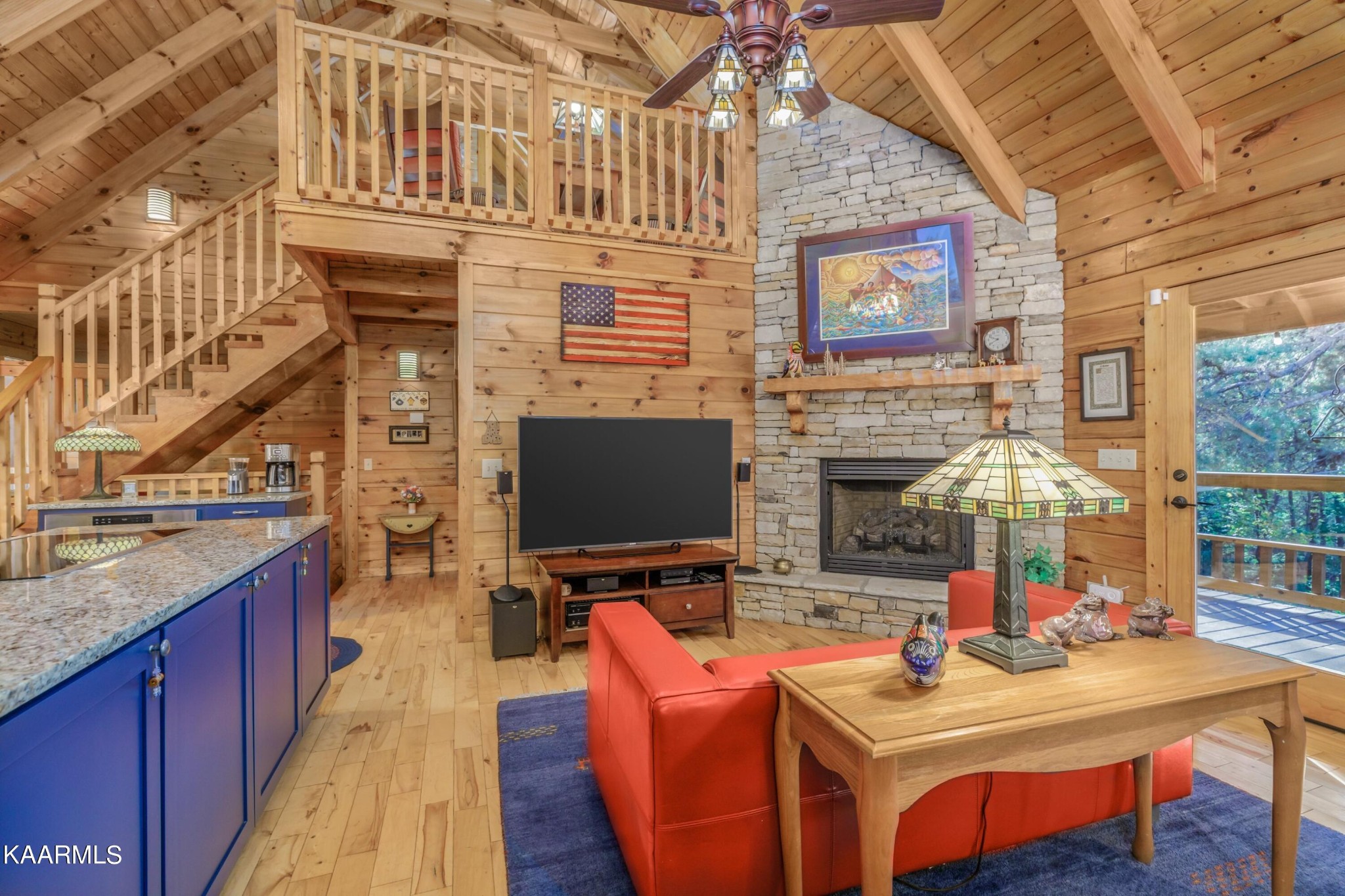 1524 Sandy Ridge Road Dandridge, TN 37725 - Photo 24 of 42 a dining room with fireplace furniture and a flat screen tv