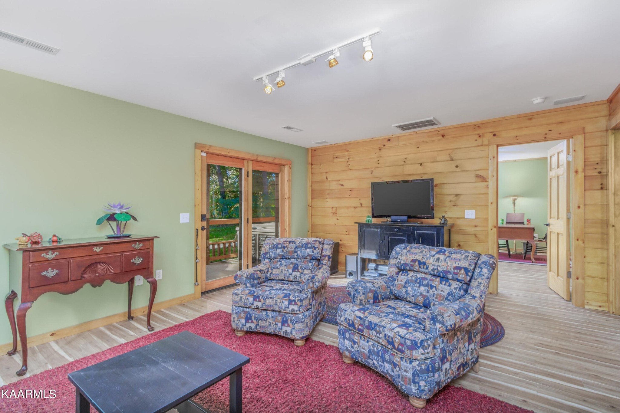 1524 Sandy Ridge Road Dandridge, TN 37725 - Photo 36 of 42 a living room with furniture and a flat screen tv