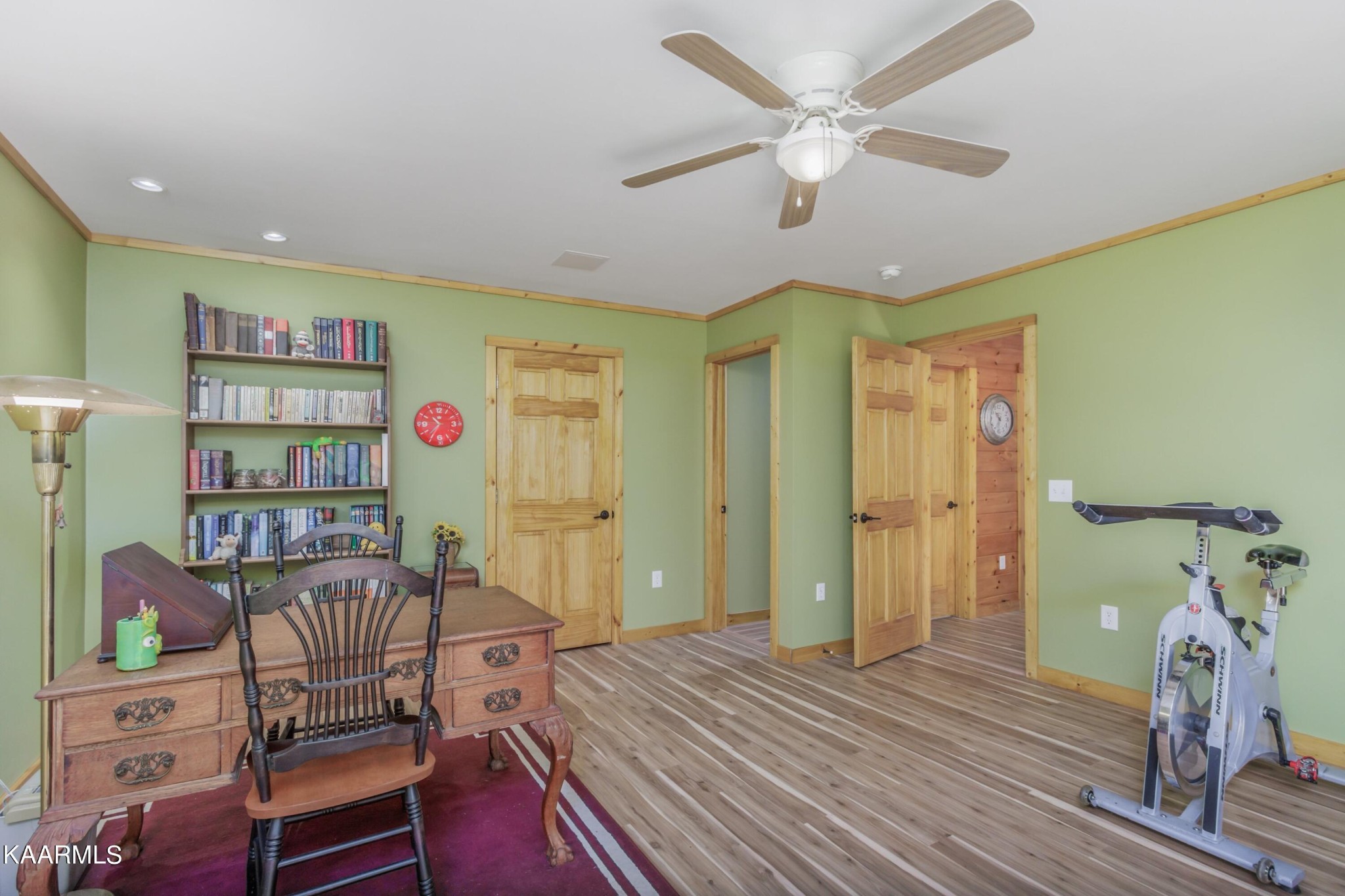 1524 Sandy Ridge Road Dandridge, TN 37725 - Photo 40 of 42 a bedroom with a bed and a chandelier