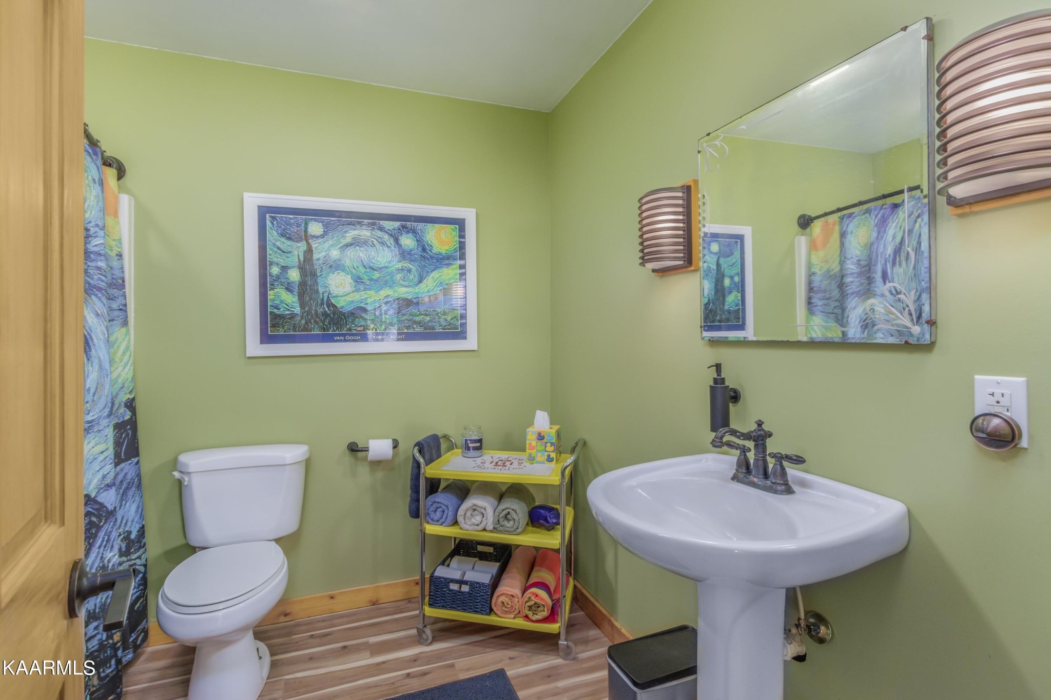1524 Sandy Ridge Road Dandridge, TN 37725 - Photo 41 of 42 a bathroom with a sink mirror and toilet