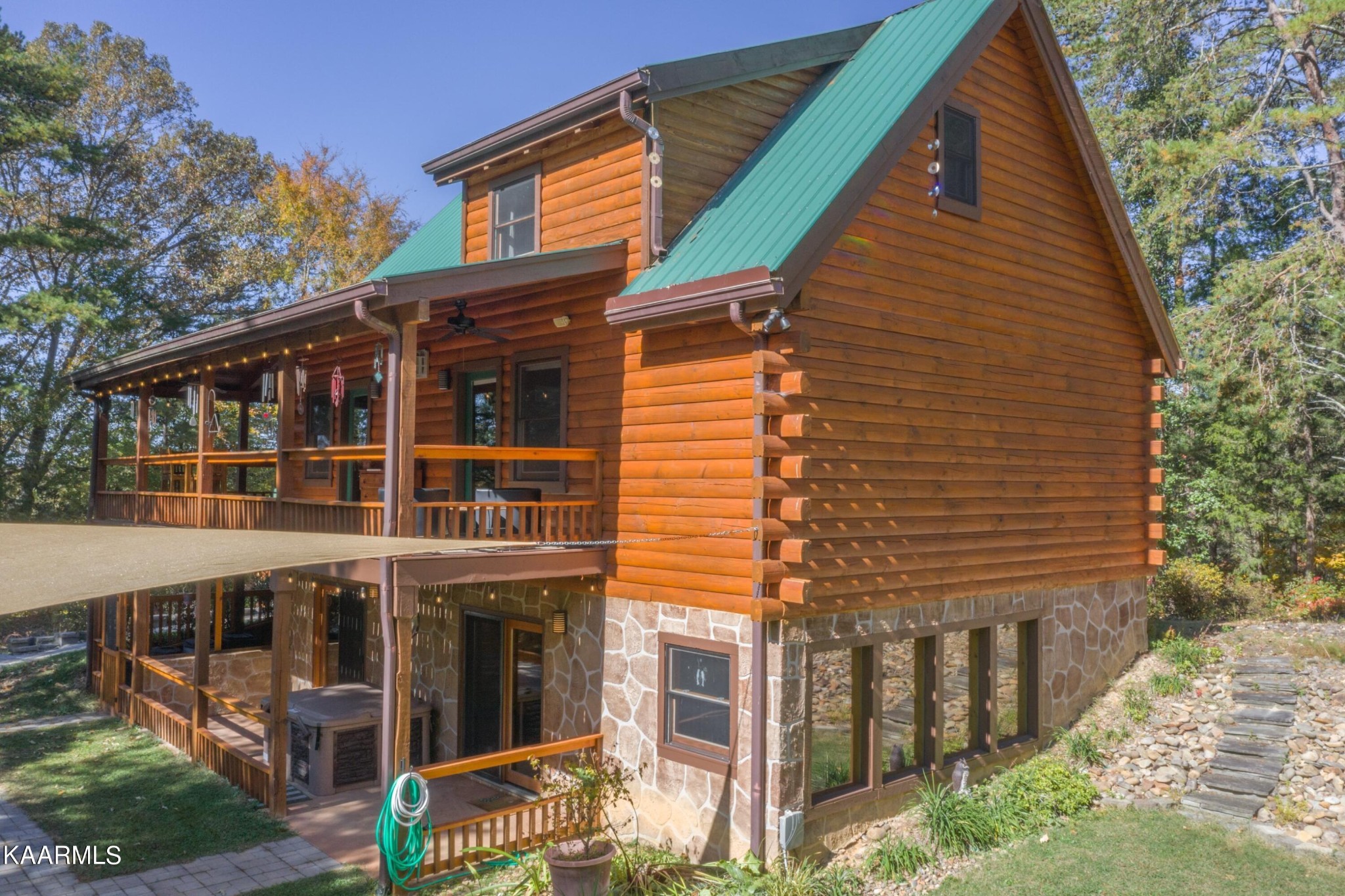 1524 Sandy Ridge Road Dandridge, TN 37725 - Photo 5 of 42 a view of a house with a yard and balcony