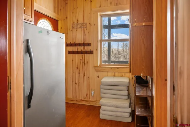 a view of walk in closet with empty racks