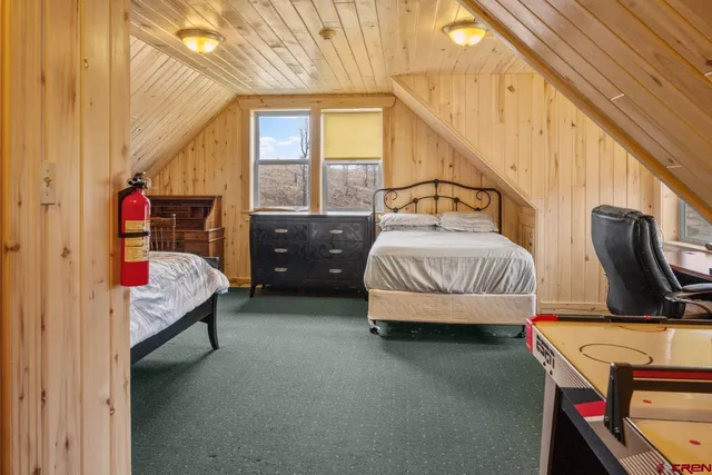 a bedroom with bed and window