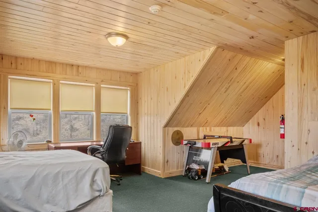 a bedroom with furniture and a window