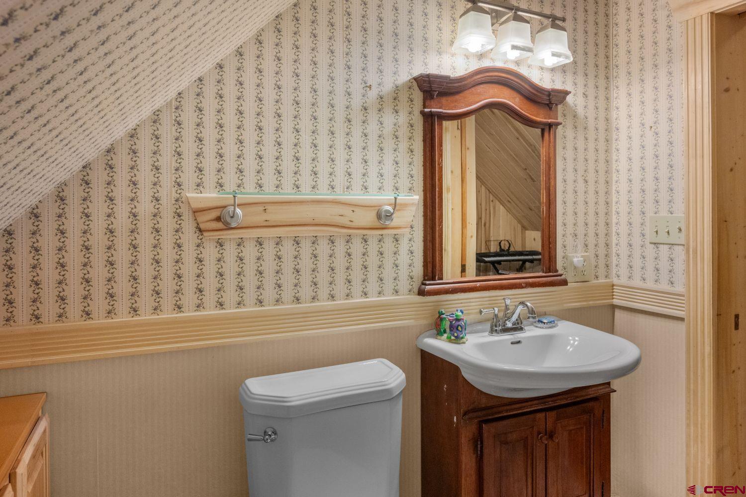 645 Emery Loop Fort Garland, CO 81133 - Photo 31 of 44 a bathroom with a sink a toilet and shower