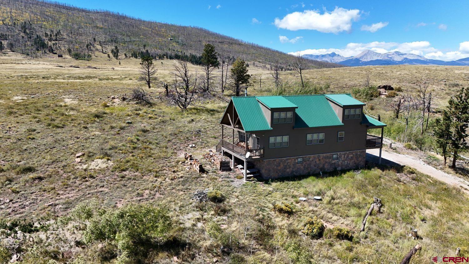 645 Emery Loop Fort Garland, CO 81133 - Photo 40 of 44 a view of a bench in the middle of a yard