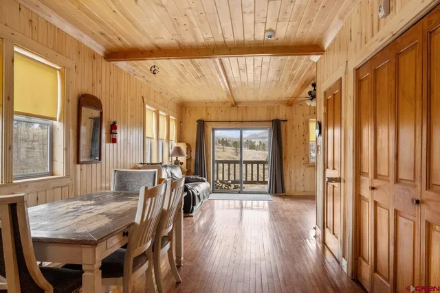 a dining room with furniture window wooden floor