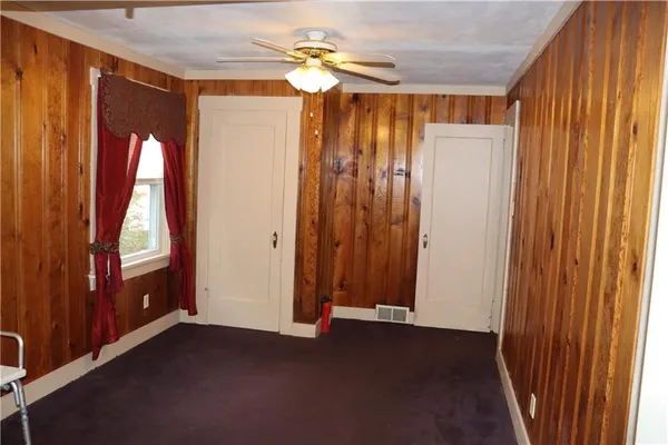 a view of a bathroom with a shower and a window