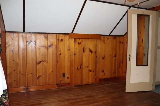 a view of a door with wooden floor