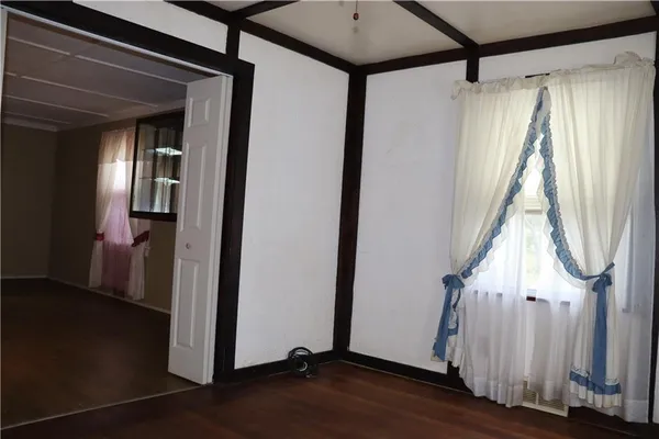 a view of a house with wooden floor and stairs