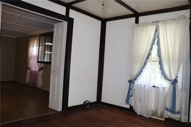 a view of a house with wooden floor and stairs