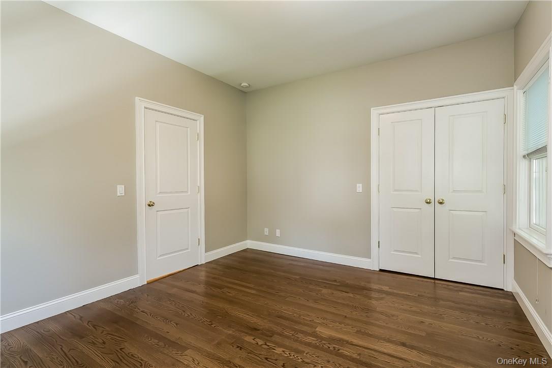 20 Walker Avenue Rye, NY 10580 - Photo 15 of 25 a view of an empty room with wooden floor
