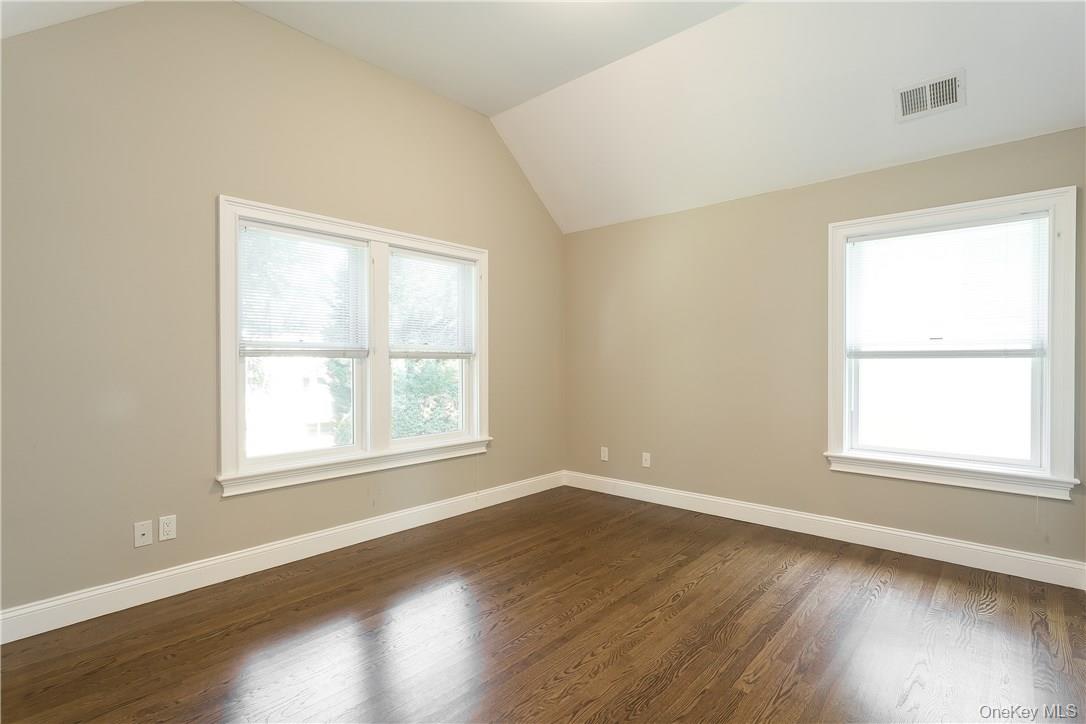 20 Walker Avenue Rye, NY 10580 - Photo 16 of 25 an empty room with wooden floor and windows