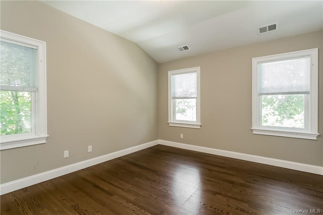 20 Walker Avenue Rye, NY 10580 - Photo 17 of 25 an empty room with wooden floor and windows