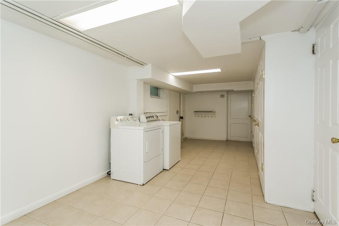 20 Walker Avenue Rye, NY 10580 - Photo 20 of 25 a utility room with cabinets washer and dryer