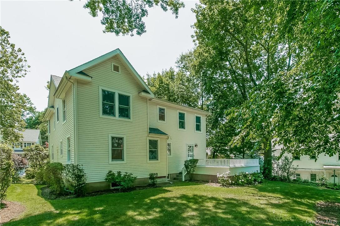 20 Walker Avenue Rye, NY 10580 - Photo 21 of 25 a backyard of a house with lots of green space