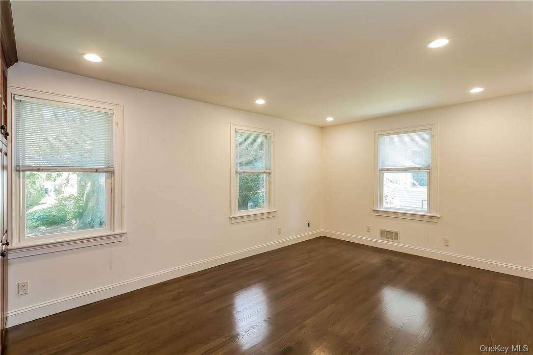 20 Walker Avenue Rye, NY 10580 - Photo 4 of 25 an empty room with wooden floor and windows