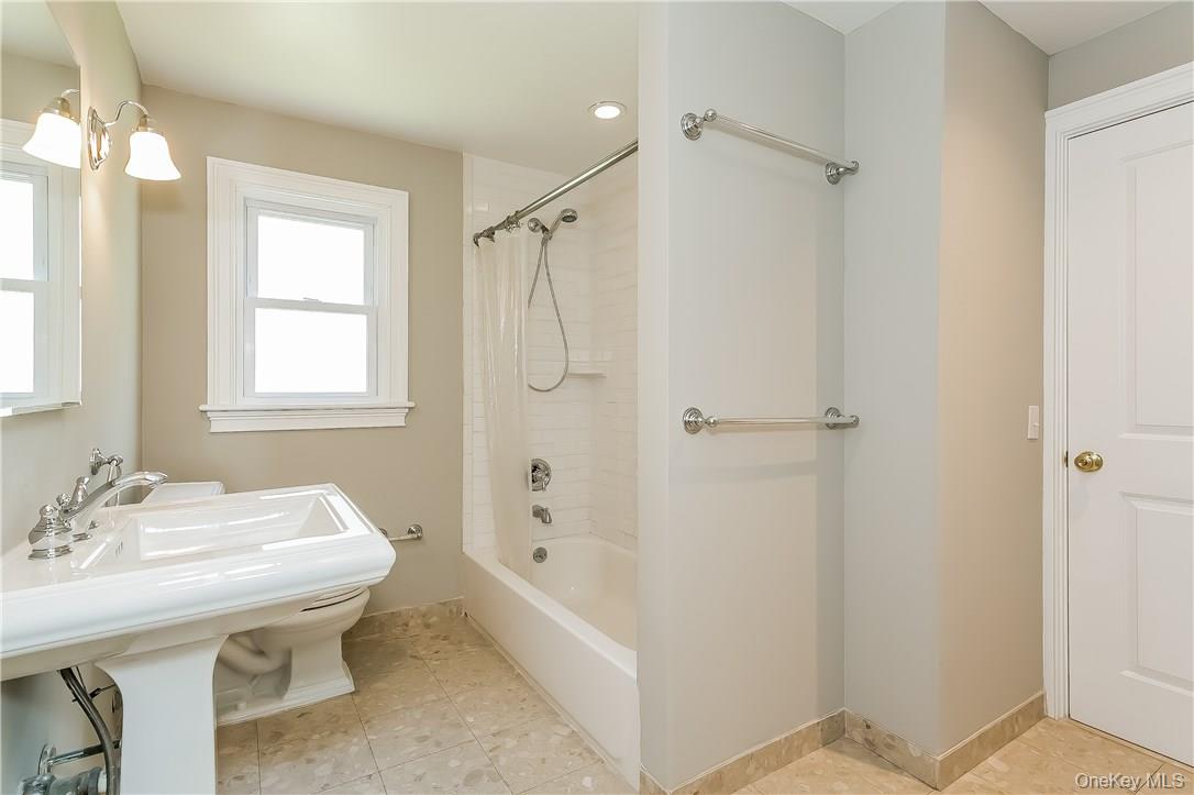 20 Walker Avenue Rye, NY 10580 - Photo 7 of 25 a bathroom with a sink toilet and shower