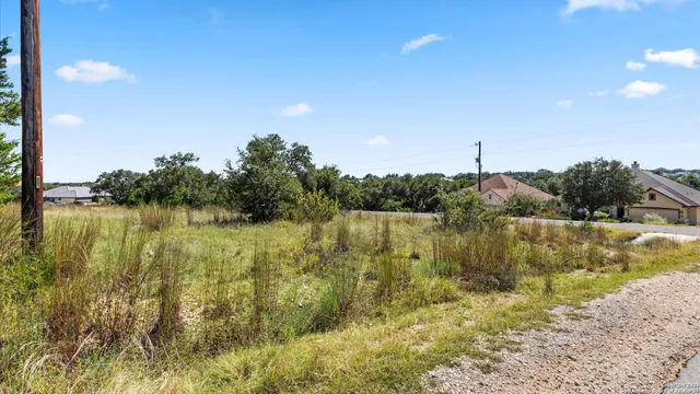 a view of lake with green space