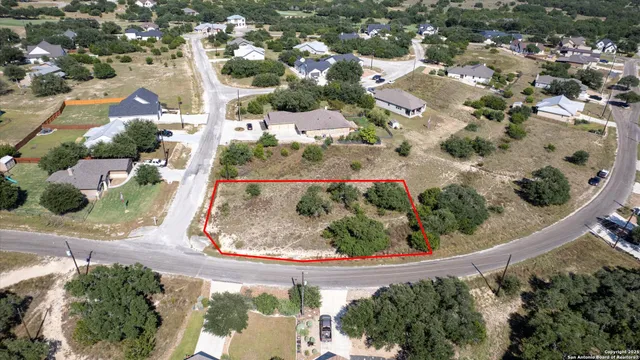 an aerial view of a highlighted house