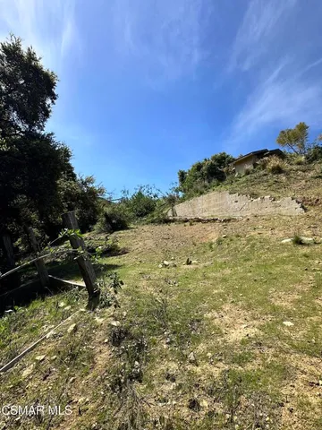 a view of a lake with a yard