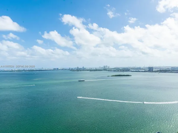 a bathroom with a toilet a sink and shower