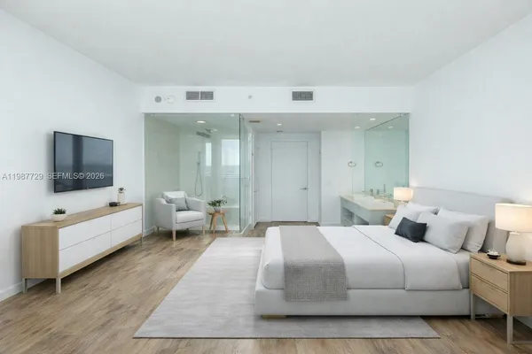 a view of a room with wooden floor