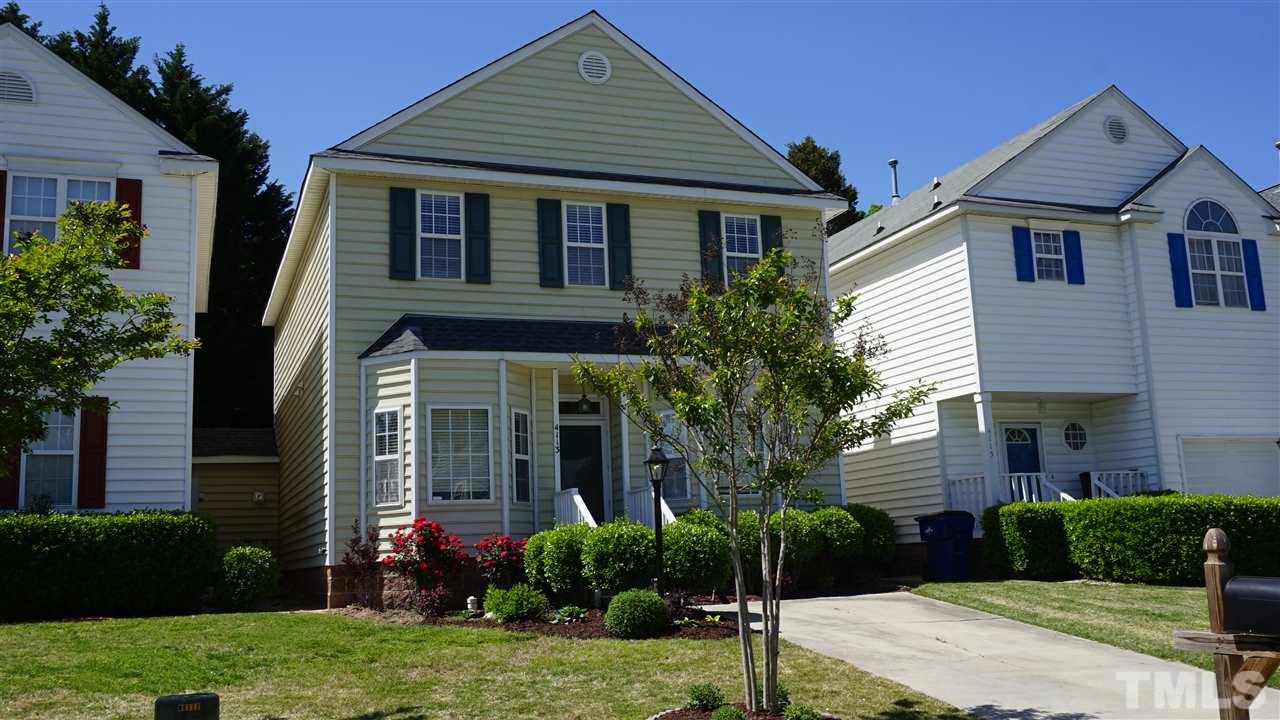 4113 Beaufain Street Raleigh, NC 27604 - Photo 3 of 16 a front view of a house with a yard