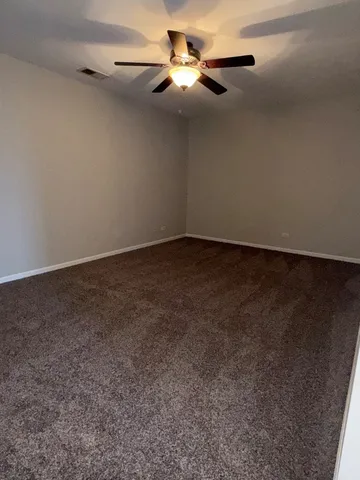 a spacious bathroom with a bathtub sink and mirror