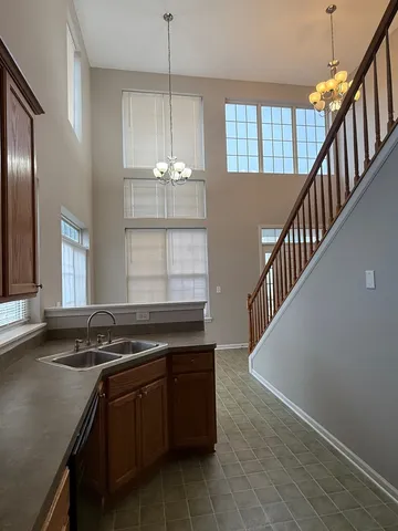 a kitchen that has a lot of cabinets in it