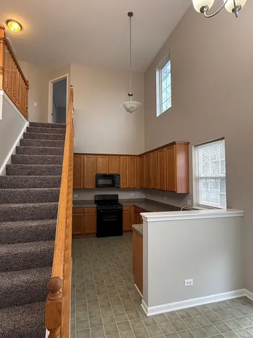 a kitchen with a stove and a microwave