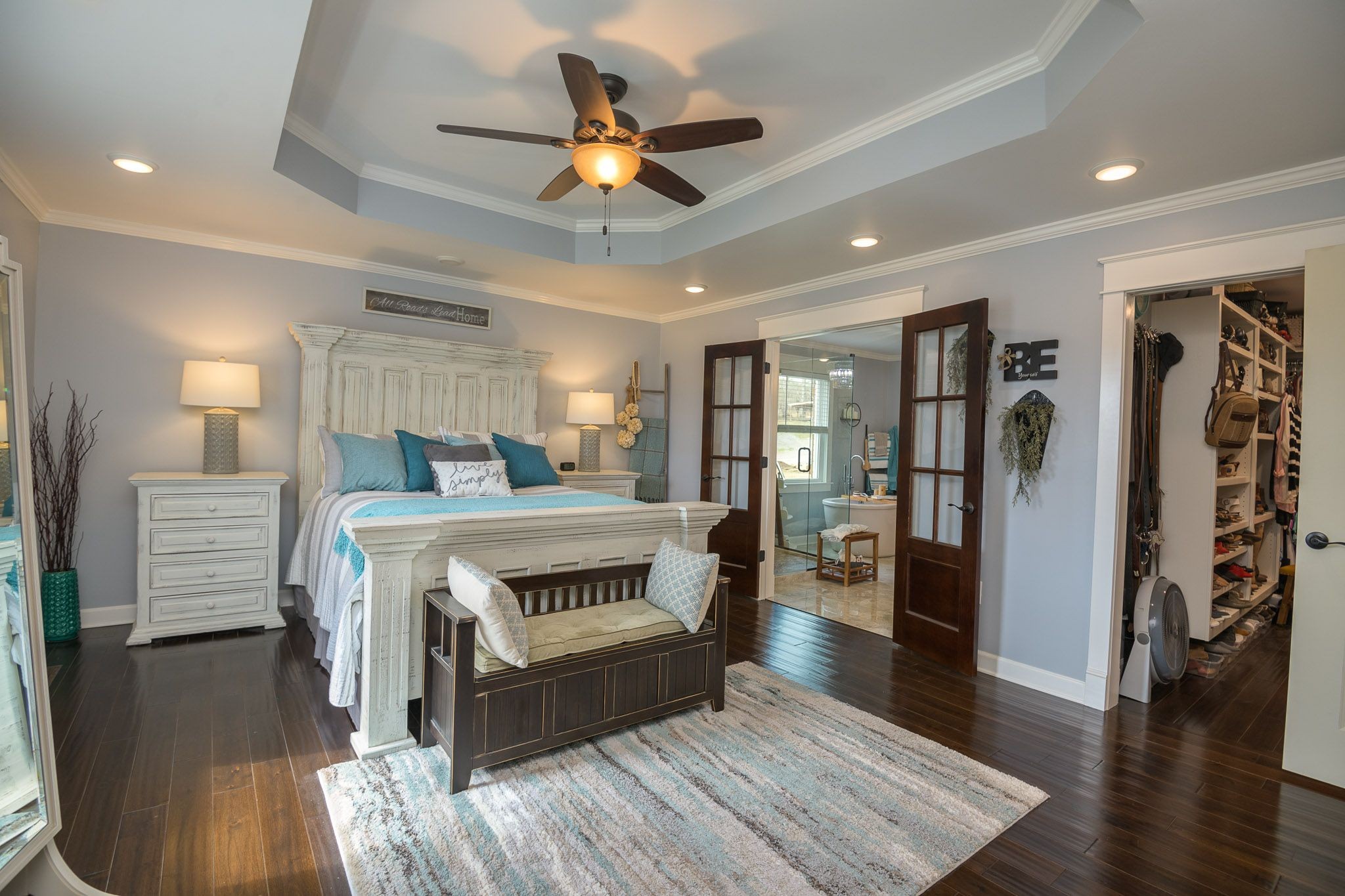 2427 Lower Helton Road Alexandria, TN 37012 - Photo 22 of 43 a bedroom with a large bed a flat tv screen and a ceiling fan