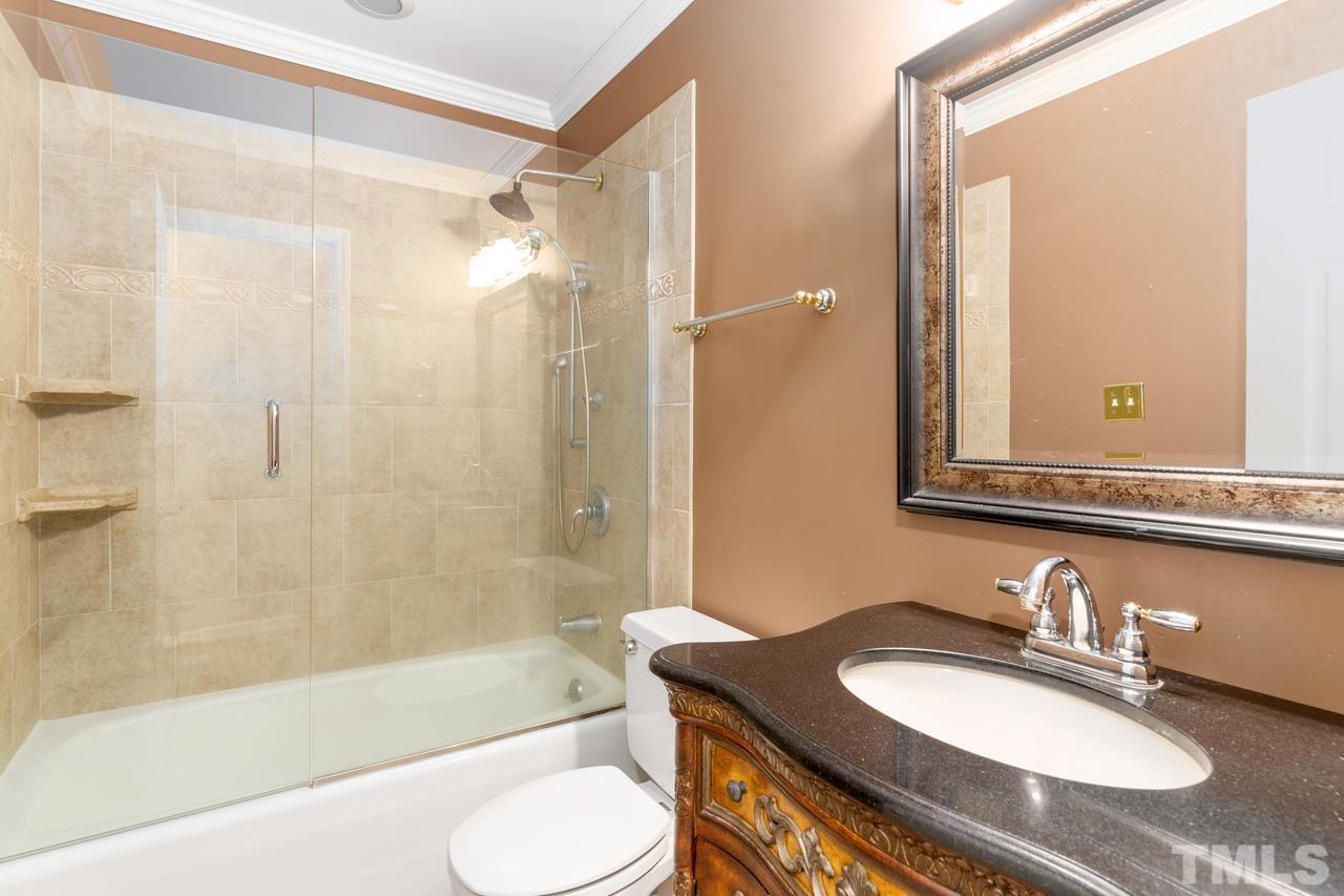 300 Dunstable Court Raleigh, NC 27614 - Photo 21 of 21 a bathroom with a granite countertop sink mirror toilet and bathtub